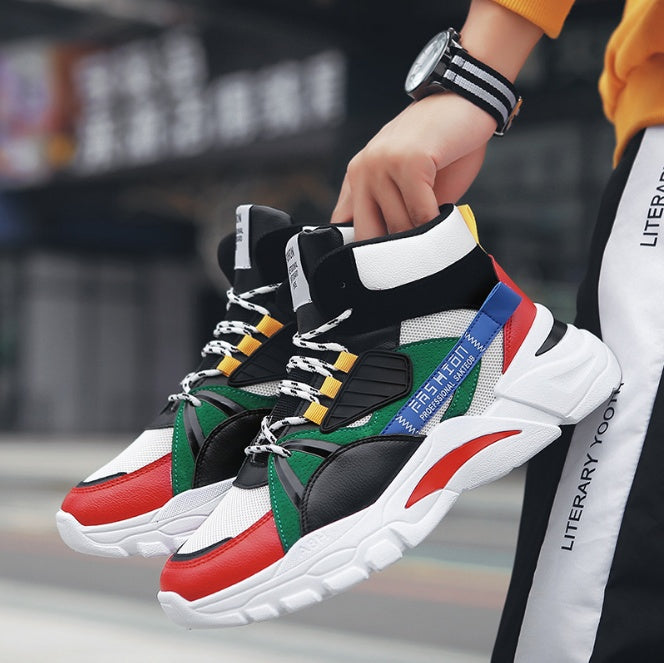 Black high-top sneakers with white sole, red toe, green panel, and yellow lace accents