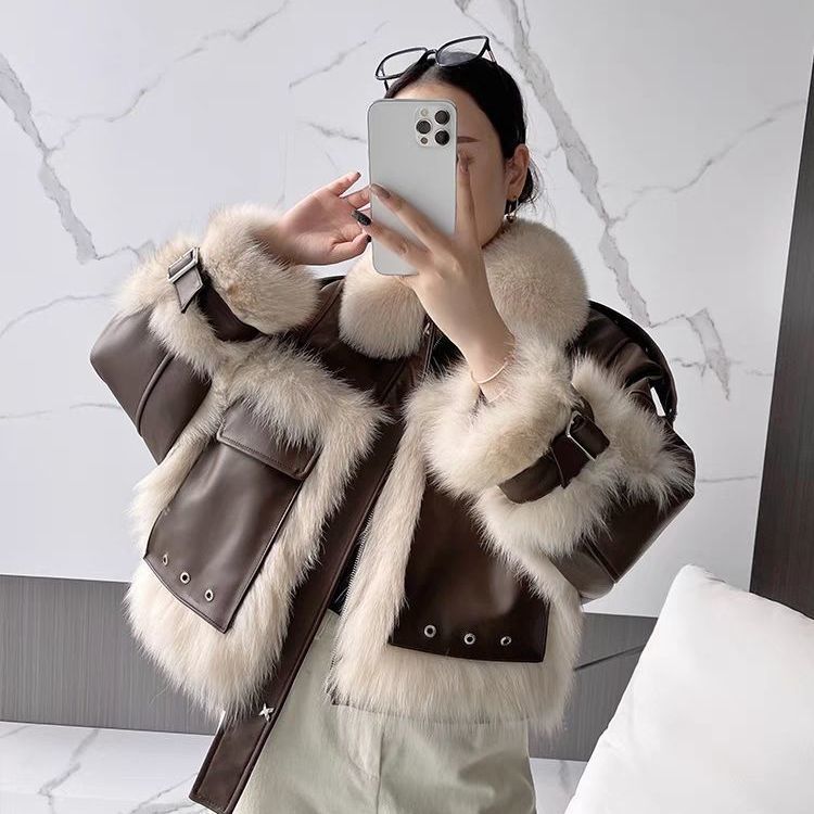 Brown leather coat with cream faux-fur collar and cuffs, studded front pockets and snaps