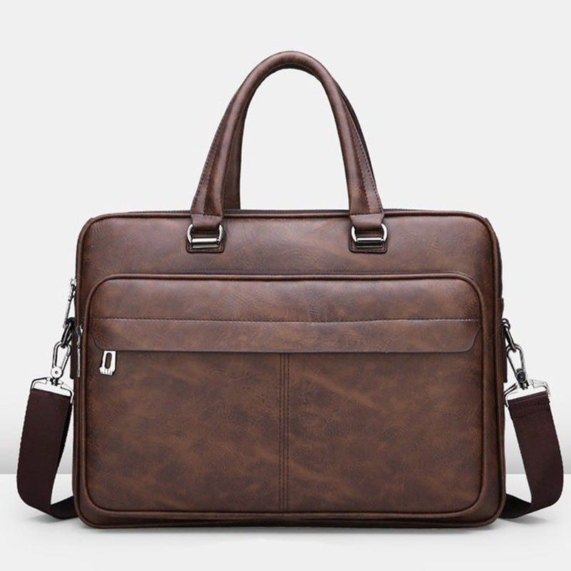 Dark brown leather briefcase with top handles and front zipper pocket; shoulder straps