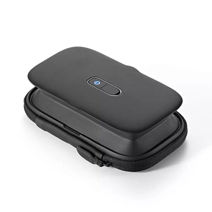 Black electronic device with a power button on a white background