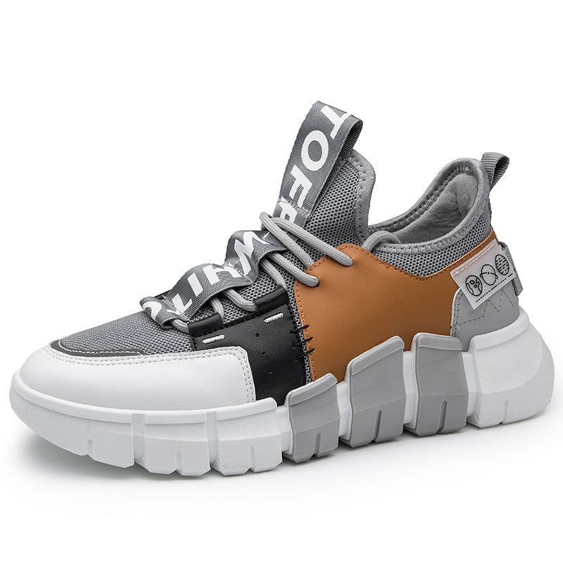 Gray casual sneaker with chunky sole, lace-up, and tan leather-look panel detail.
