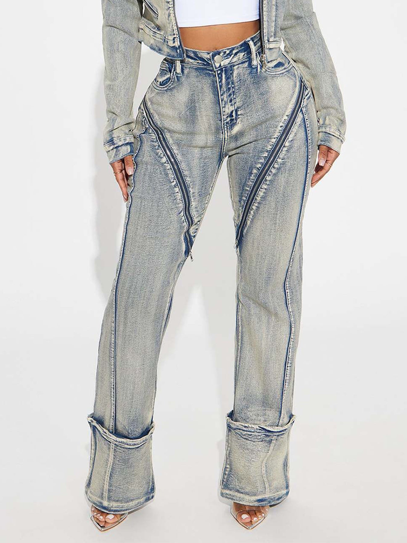 Washed denim pants in light blue with contrast seam detail and wide cuffed hems