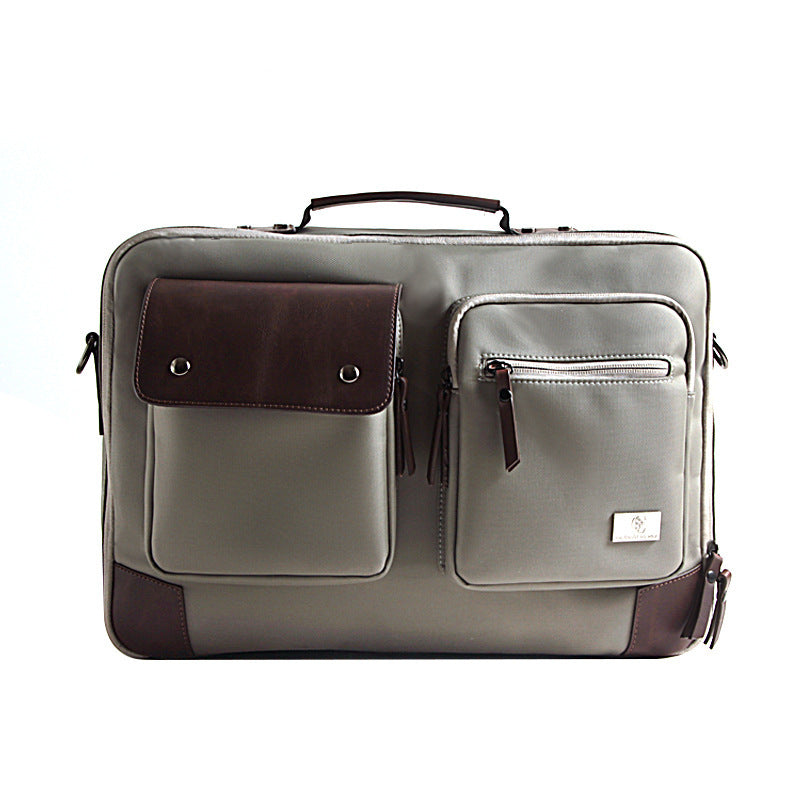 Gray laptop briefcase with brown front pocket and light gray zip organizer, top handle