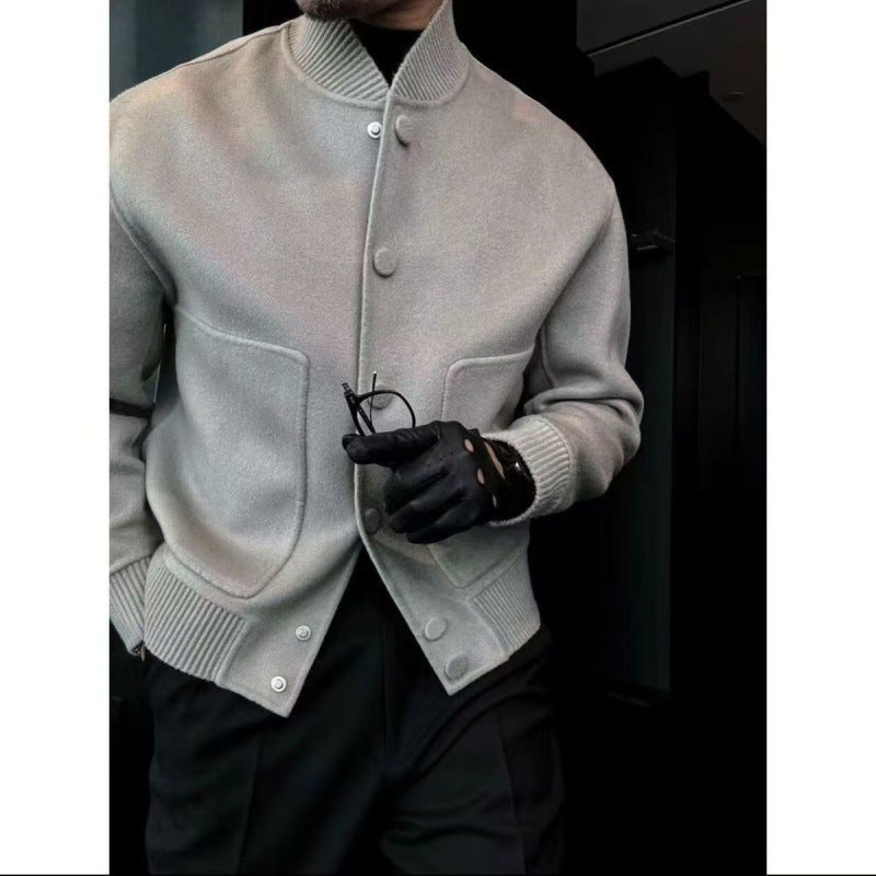 Light gray stand-up collar jacket with snap buttons, front pockets, ribbed cuffs