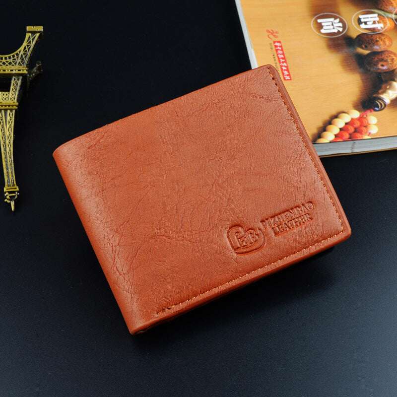 Slim short leather wallet in orange-brown with embossed logo on the front