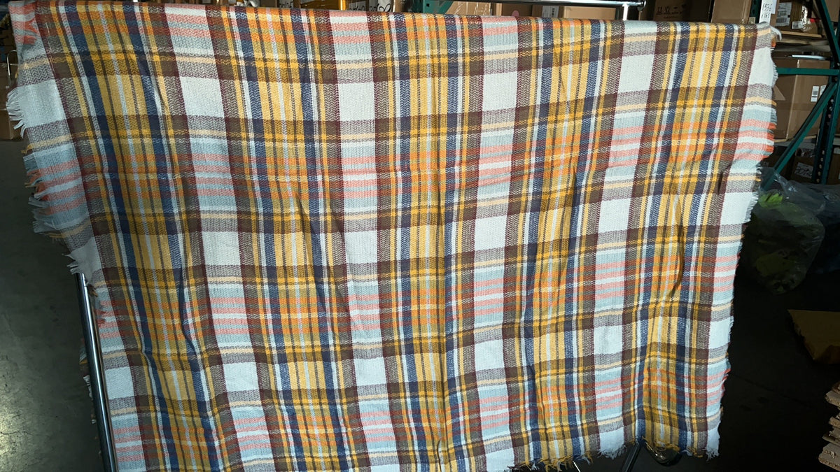 Plaid scarf fabric with yellow, blue, white, and rust stripes; fringed edge