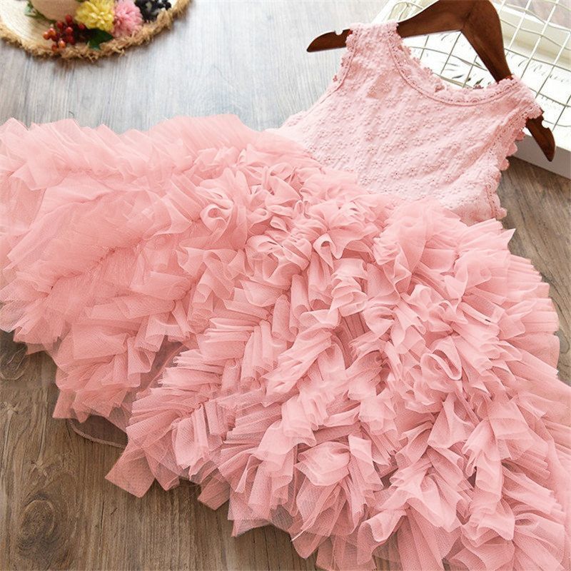 Girls lace princess dress laid flat, light pink lace bodice and full ruffled tulle skirt