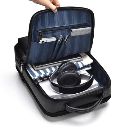 Black computer backpack open, showing blue organizer compartments and elastic slots