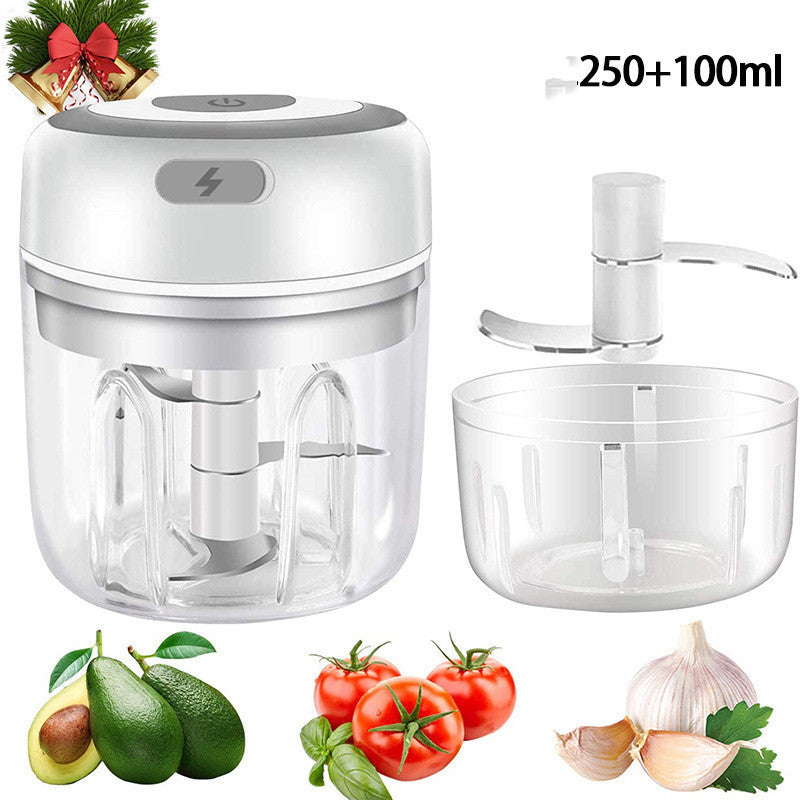 Electric garlic chopper with white lid, clear container and detachable chopper blade
