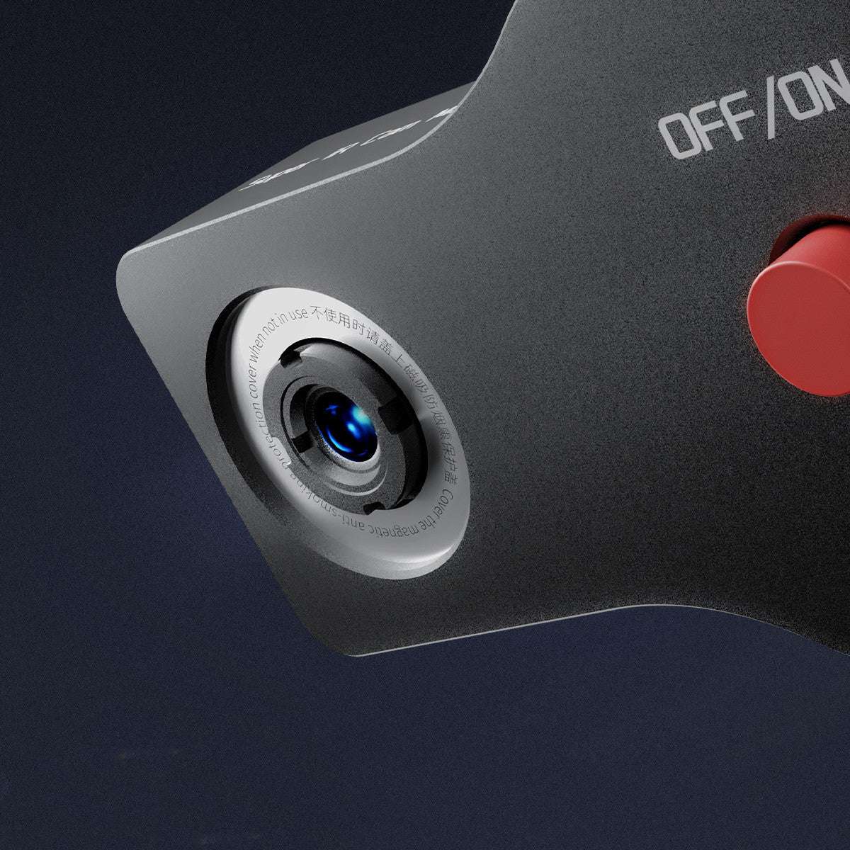 Camera lens with 'OFF/ON' switch on a dark background