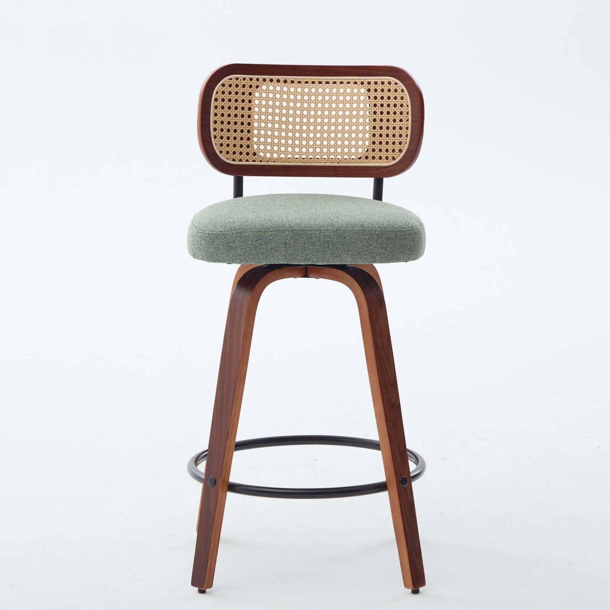 Swivel counter stool with light green upholstered seat and cane rattan back, dark wood