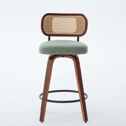 Swivel counter stool with light green upholstered seat and cane rattan back, dark wood