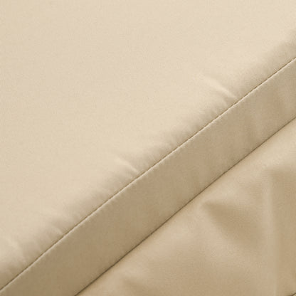 Beige outdoor cushion fabric close-up with stitched seams and smooth surface