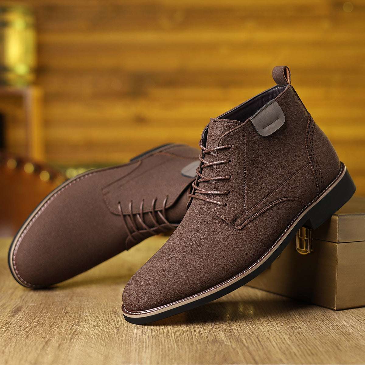 Men's brown high-top lace-up boots with ankle strap and stitched side panels