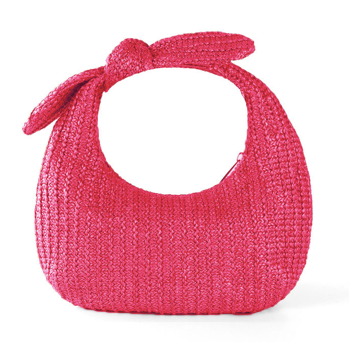 Pink straw bow clutch handbag with tied bow handle and textured woven body