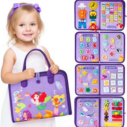 Child holding a purple educational toy bag with various educational panels.