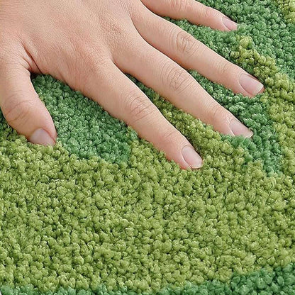 Kiwi fruit bath mat texture, green loop pile with hand touching; black seed dots