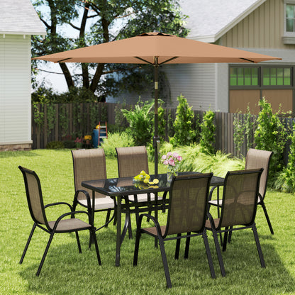 Patio dining set with brown mesh chairs, black table, and tan umbrella overhead on grass.