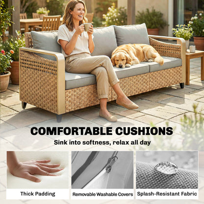 3-seat rattan outdoor sofa with gray cushions, with dog resting on seat