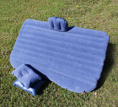Blue ribbed inflatable car mattress with two small side pillows
