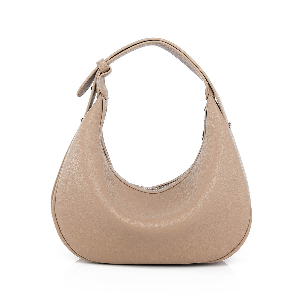 Beige hobo bag with short handles and side seam detail