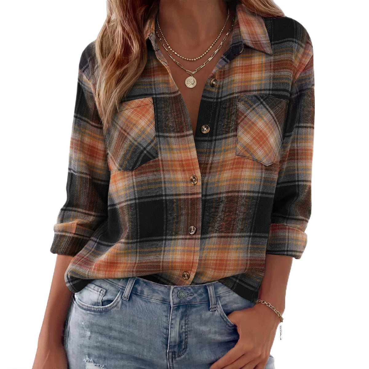 Loose-fit plaid button-up shirt in black and orange checks with chest pockets