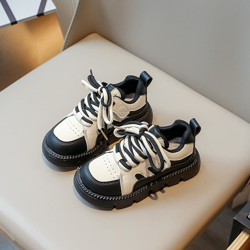 Girls platform sneakers, white and dark uppers, thick treaded sole and cushioned collar