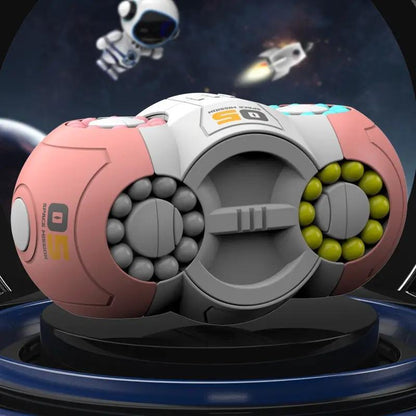 Rotating magic bean cube fidget toy with pink outer panels, grey center, green and dark grey bead rings