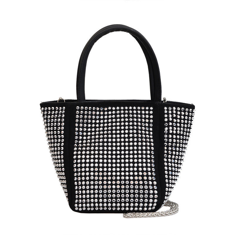 Black rhinestone tote bag with top handles and silver chain crossbody strap
