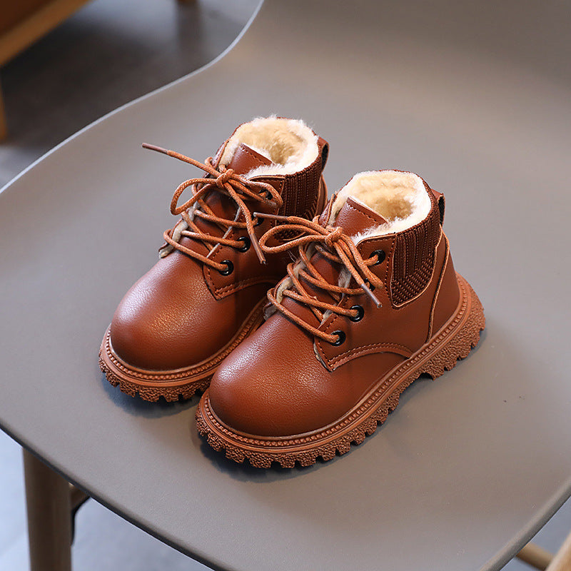 Rust brown leather lace-up ankle boots with tan fur lining and chunky tread