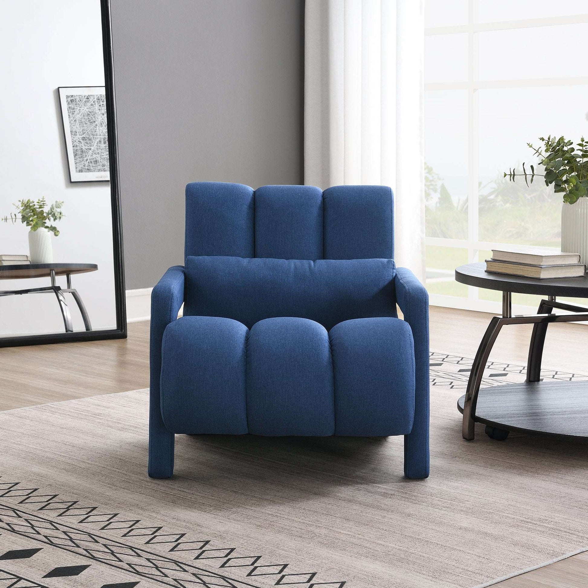 Dark blue upholstered accent chair with plump seat cushions and short arms