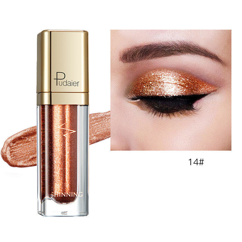Glitter eyeshadow tube with copper bronze shimmer and matching eyelid swatch, Tudaier