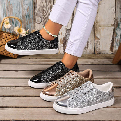 Black sequin lace-up board shoes with white rubber sole, low profile.