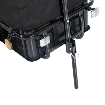 Black cargo trailer corner with white reflector and hitch support bar
