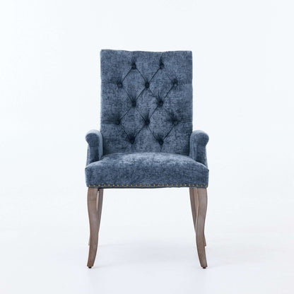 Blue upholstered accent dining chair with tufted back, cushioned seat, and wooden legs