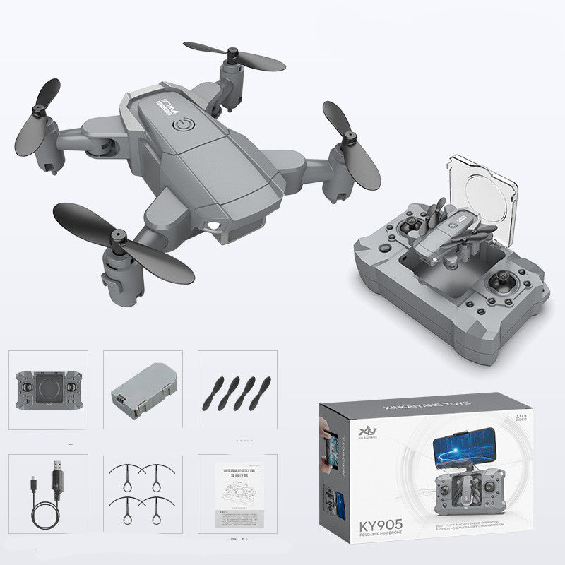 Gray quadcopter drone with four propellers and gray remote controller, with accessory box