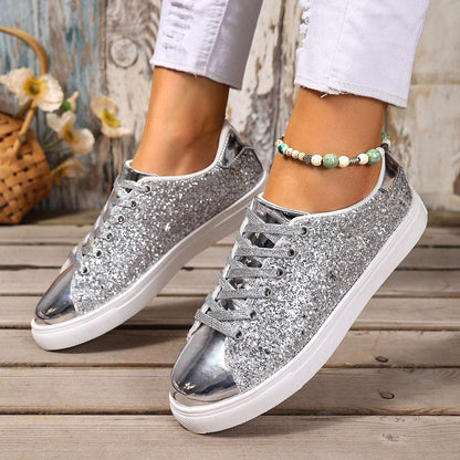 Silver-gray sequin lace-up board shoes with white rubber sole, low profile.