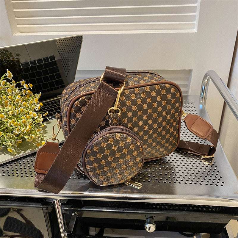 Brown patterned shell crossbody bag with long strap and round front pouch