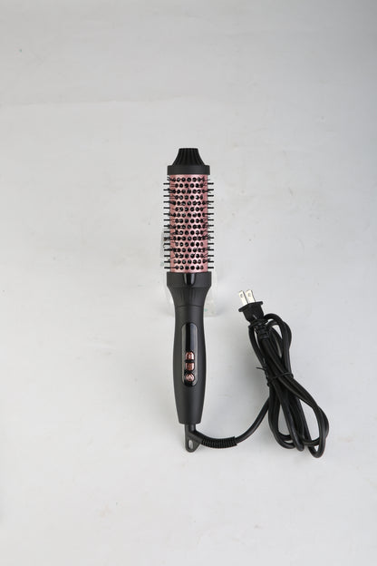 Black hot air styling brush with rose-gold bristle barrel and power cord