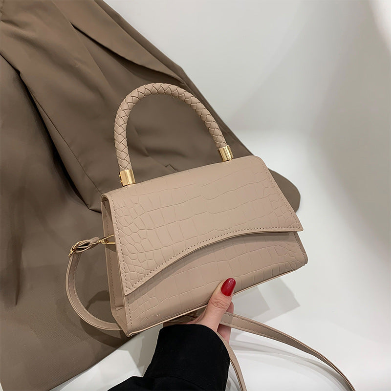 Khaki croc-texture shoulder bag with top handle, flap front, and gold hardware