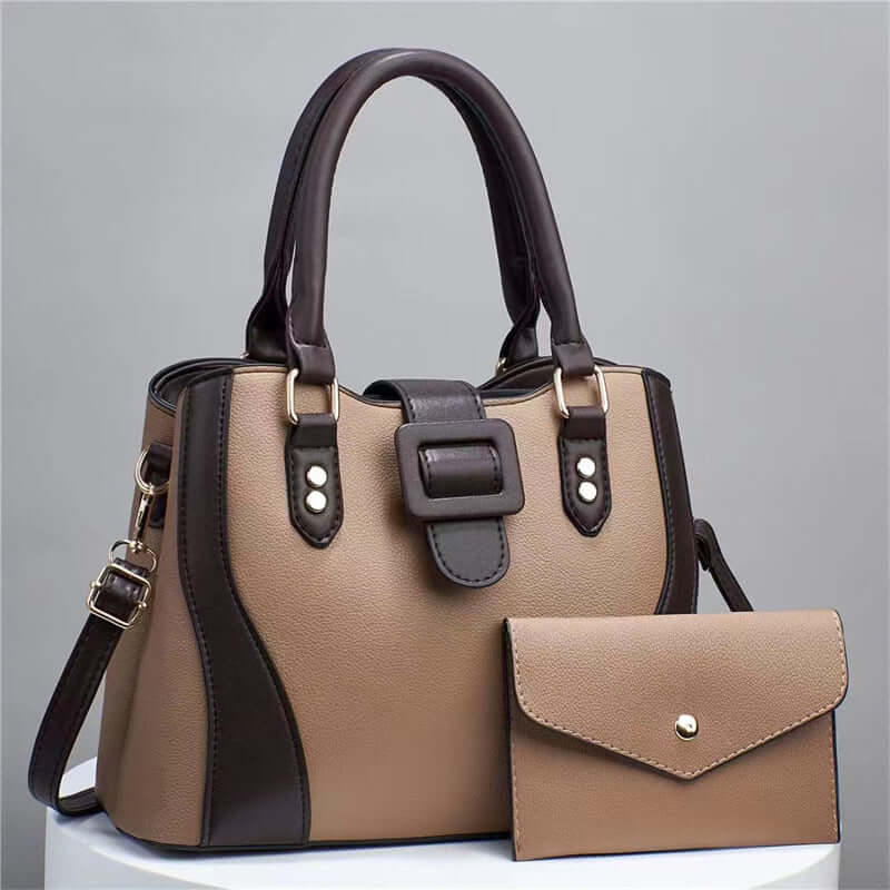 Tan tote bag with black side panel and matching envelope clutch pouch
