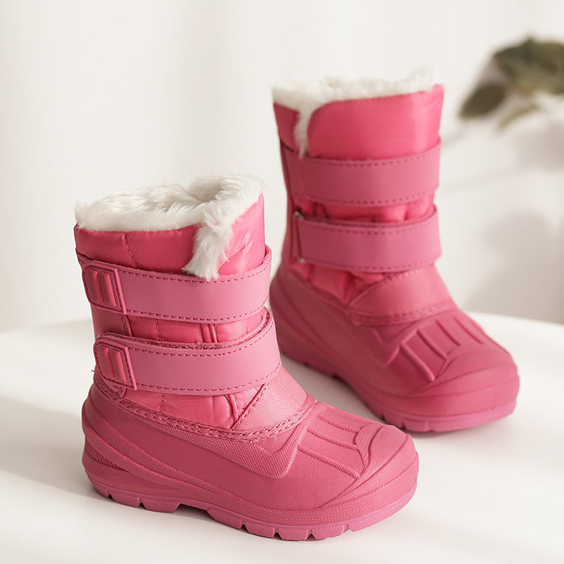Kids winter snow boots in pink with plush white cuff and padded strap closures