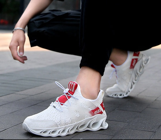 Breathable Blade running sneaker, white upper with red heel strap, worn with black pants
