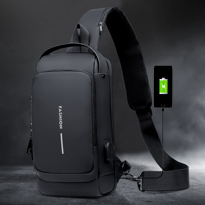 Anti-theft chest bag with front pocket and crossbody strap, black bag on gray
