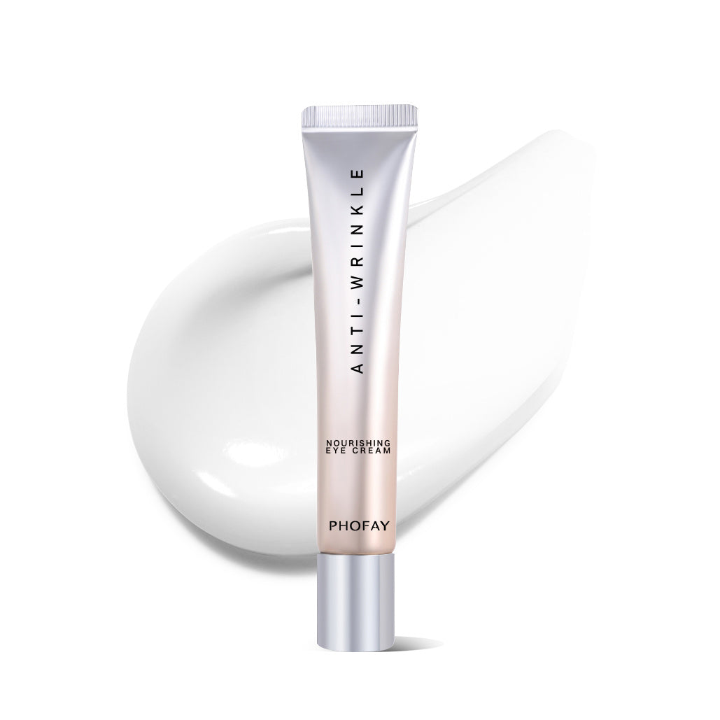 Eye cream tube with white cap, silver pump base, and beige cream