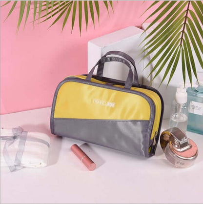 Large cosmetic storage bag in yellow and gray color-block design, zip top