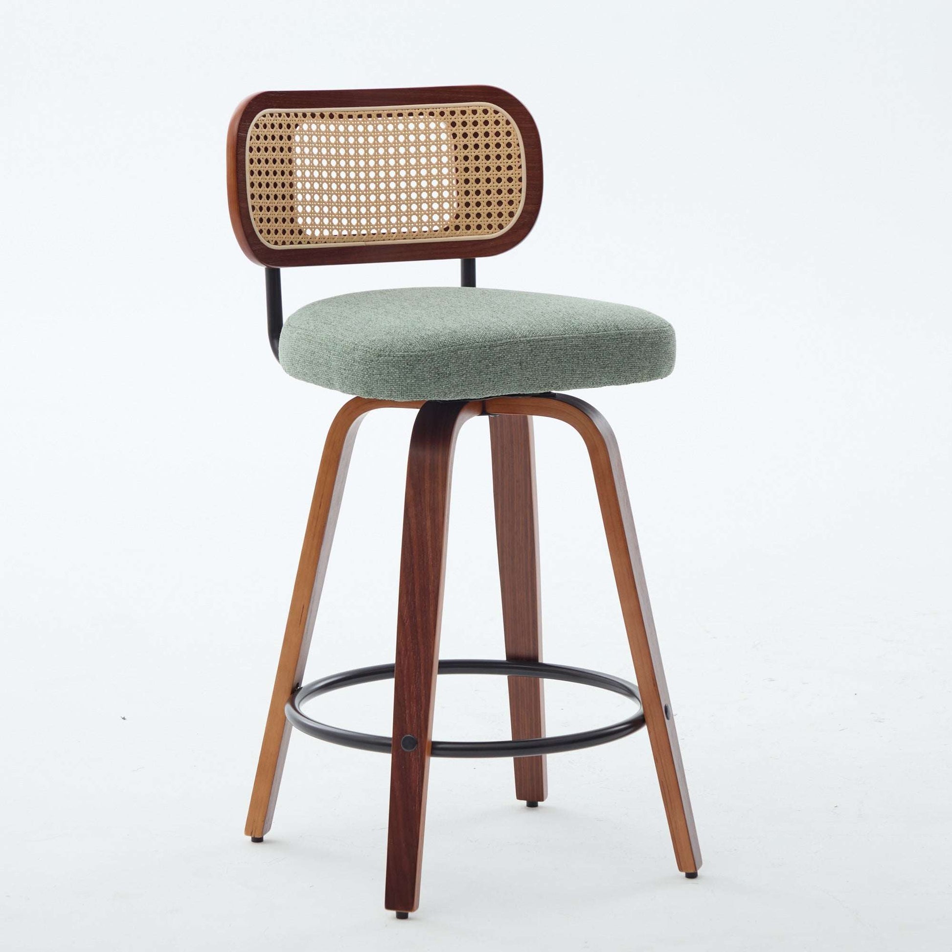 Swivel counter stool with light green seat, cane rattan back panel, dark wood legs