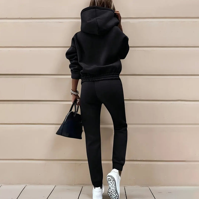 Two-piece casual tracksuit for women, black back view with hooded sweatshirt and joggers