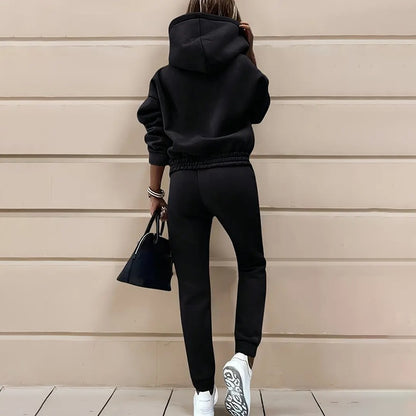 Two-piece casual tracksuit for women, black back view with hooded sweatshirt and joggers