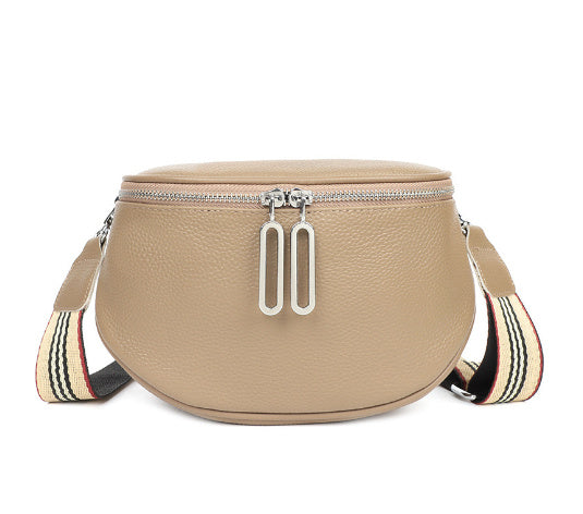 Cowhide casual shoulder bag in beige with double-zip pulls and striped webbing strap.